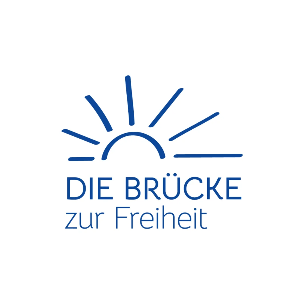 Logo Die Bruecke zur Freiheit mit stilisierter Sonne und Strahlen in Blau ueber dem Schriftzug auf hellem Hintergrund fuer einen positiven und hoffnungsvollen Auftritt
