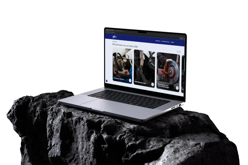 Laptop auf dunklem Felsen mit geoeffneter Webseite eines Lkw Serviceunternehmens mit Serviceangeboten vor schwarzem Hintergrund.